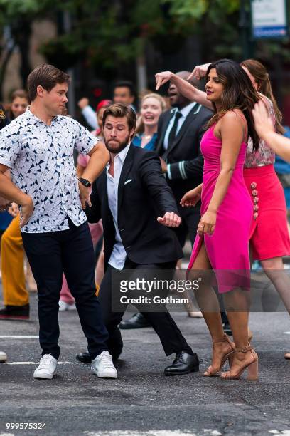 Adam Devine, Liam Hemsworth and Priyanka Chopra are seen filming a scene for 'Isn't It Romantic?' in Midtown on July 15, 2018 in New York City.