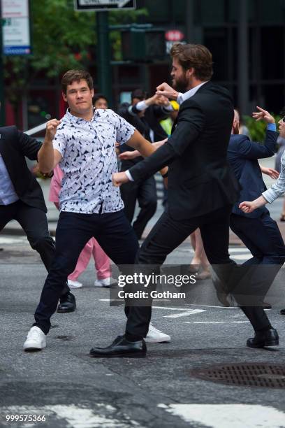 Adam Devine and Liam Hemsworth are seen filming a scene for 'Isn't It Romantic?' in Midtown on July 15, 2018 in New York City.