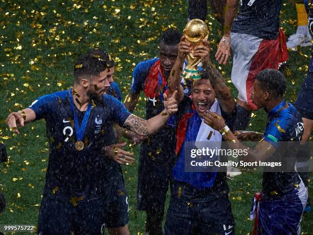 Corentin Tolisso of France celebrates with the trophy with his teammates after the 2018 FIFA World Cup Russia Final between France and Croatia at...