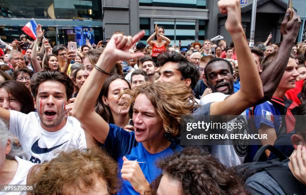 French fans react after France won the World Cup final match between France vs Croatia on July 15, 2018 in New York. - The World Cup final between...