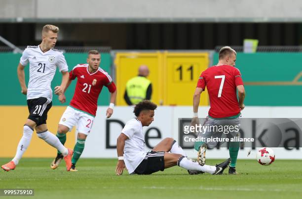 Germany's Thilo Kehrer and Hungary's Gabor Makrai vie for the ball, Tim Starke and Donat Zsoter watch it during the Under 21 test match between...