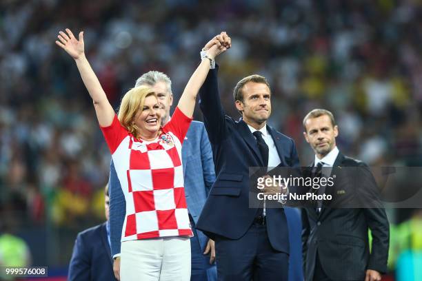 Kolinda Grabar-Kitarovi,Emmanuel Macron at the FIFA World Cup trophy at the end of of the 2018 FIFA World Cup Russia Final between France and Croatia...