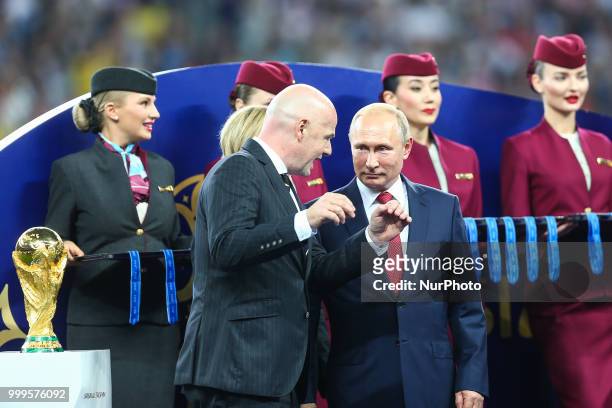 Gianni Infantino,Vladimir Putin at the FIFA World Cup trophy at the end of of the 2018 FIFA World Cup Russia Final between France and Croatia at...