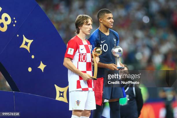 Luka Modric , Kylian Mbappe celebrate victory with the FIFA World Cup trophy at the end of of the 2018 FIFA World Cup Russia Final between France and...