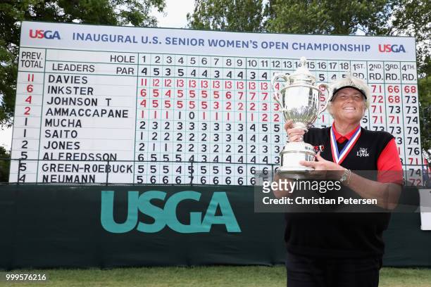Laura Davies of England poses with the U.S. Senior Women's Open trophy after winning in the final round at Chicago Golf Club on July 15, 2018 in...