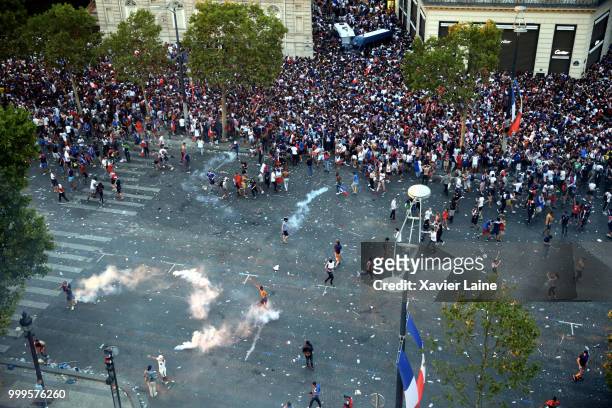Unruly fans during celebrations of France's victory against Croatia in the 2018 FIFA World Cup final at Champs Elysee on July 15, 2018 in Paris,...
