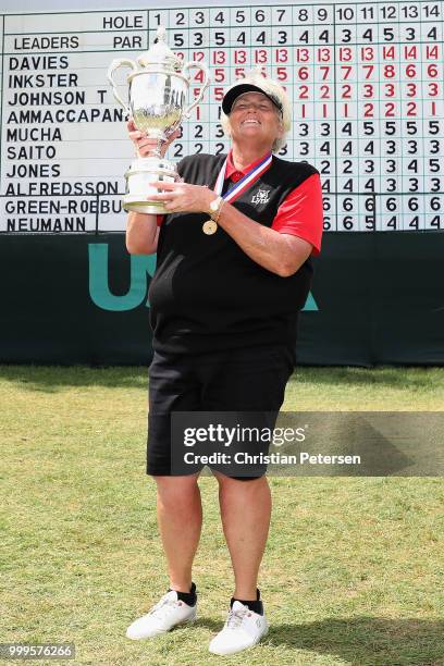 Laura Davies of England poses with the U.S. Senior Women's Open trophy after winning in the final round at Chicago Golf Club on July 15, 2018 in...