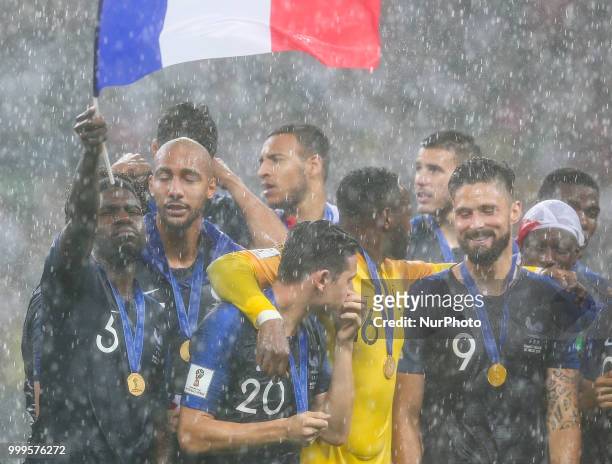 Samuel Umtiti Florian Thauvin Steve Mandanda Olivier Giroud celebrate victory with the FIFA World Cup trophy at the end of of the 2018 FIFA World Cup...