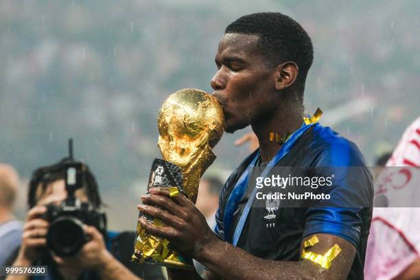 Paul Pogba celebrate victory with the FIFA World Cup trophy at the end of of the 2018 FIFA World Cup Russia Final between France and Croatia at...