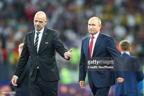 Wladimir Putin,Gianni Infantino at the FIFA World Cup trophy at the end of of the 2018 FIFA World Cup Russia Final between France and Croatia at...