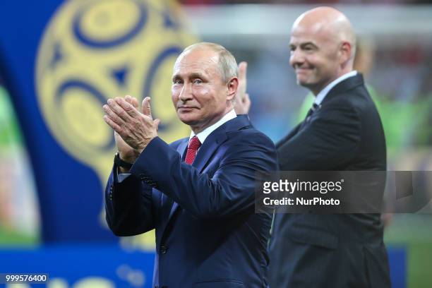 Wladimir Putin,Gianni Infantino at the FIFA World Cup trophy at the end of of the 2018 FIFA World Cup Russia Final between France and Croatia at...