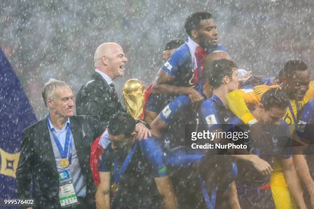 Didier Deschamps ,Gianni Infantino,Paul Pogba Antoine Griezmann celebrate victory with the FIFA World Cup trophy at the end of of the 2018 FIFA World...