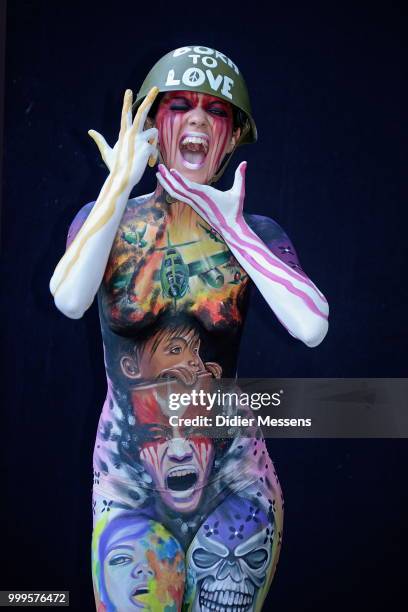 Model, painted by bodypainting artist Gulia Giuggiolini from Italy, poses for a picture at the 21st World Bodypainting Festival 2018 on July 14, 2018...