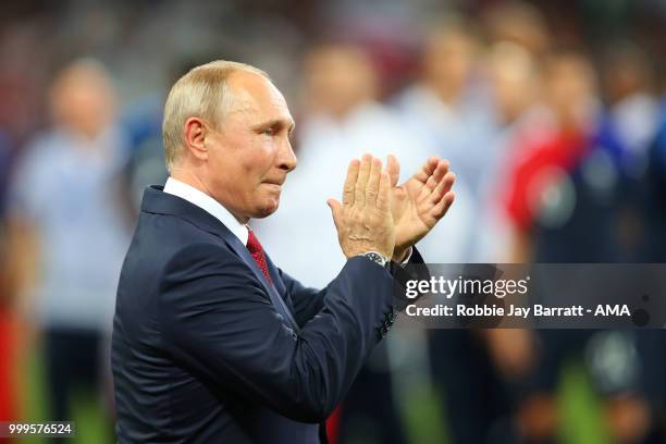 Russia's President Vladimir Putin applauds at the end of the 2018 FIFA World Cup Russia Final between France and Croatia at Luzhniki Stadium on July...