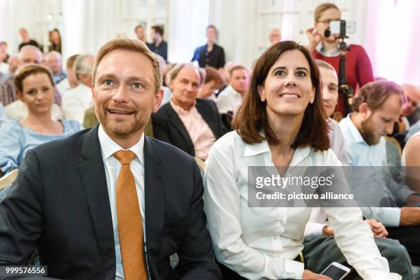 Liberal's top candidate Christian Lindner and Katja Suding, chairwoman of the FDP in Hamburg, are sitting in the front row during an election...