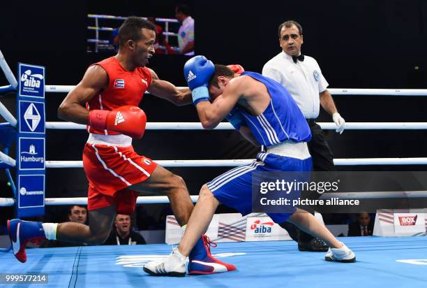 Cuban boxer Lazaro Alvarez Estrada fights Otar Eranosyan from Georgia in the Men's Light semifinal in Hamburg in the Sporthalle Hamburg, Germany, 29...