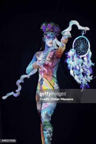 Model, painted by bodypainting artist Tiziana La Monica from Italy, poses for a picture at the 21st World Bodypainting Festival 2018 on July 14, 2018...