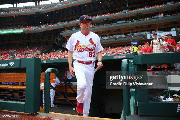 Interim manager Mike Shildt of the St. Louis Cardinals takes the field to present his line-up card prior to a game against the Cincinnati Reds at...