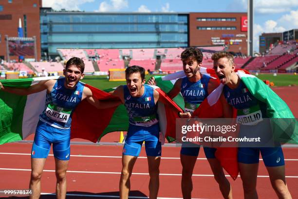 Klaudio Gjetja, Andrea Romani, Alessandro Sibilio and Edoardo Scotti of Itay celebrate winning gold in the final of the men's 4x400m relay on day six...