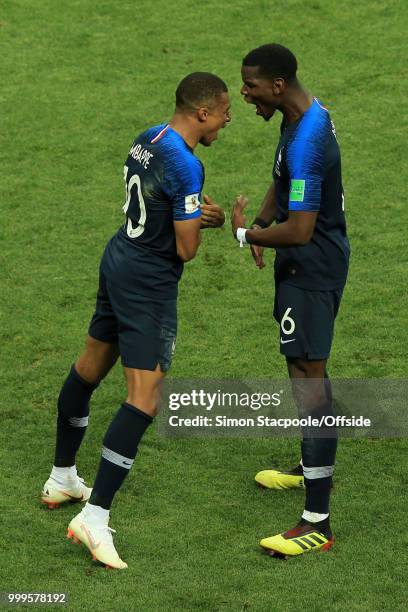 Kylian Mbappe of France celebrates with teammate Paul Pogba after scoring their 4th goal during the 2018 FIFA World Cup Russia Final between France...