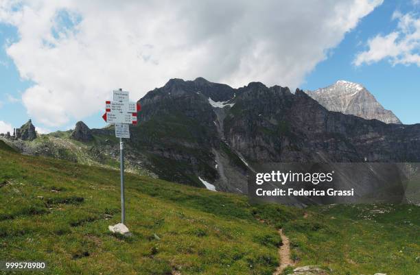 mount punta valgrande and monte leone seen from passo delle possette - leone stock-fotos und bilder