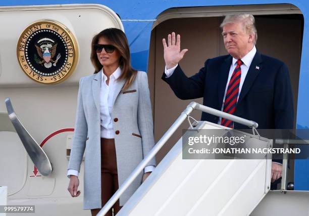 President Donald Trump and First Lady Melania Trump disembark from Air Force One upon arrival at Helsinki-Vantaa Airport in Helsinki, on July 15,...