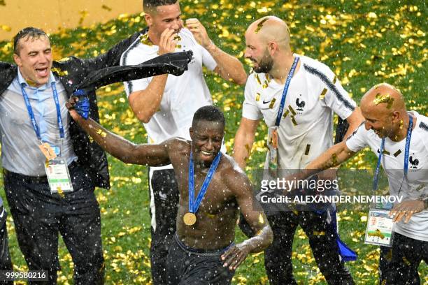 France's defender Benjamin Mendy celebrates during the trophy ceremony after winning the end of the Russia 2018 World Cup final football match...