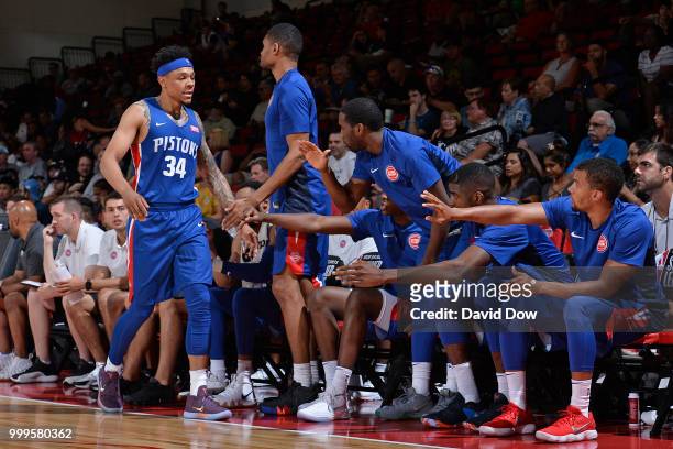 Zack Lofton of the Detroit Pistons high-fives teammates during the game against the Minnesota Timberwolves during the 2018 Las Vegas Summer League on...