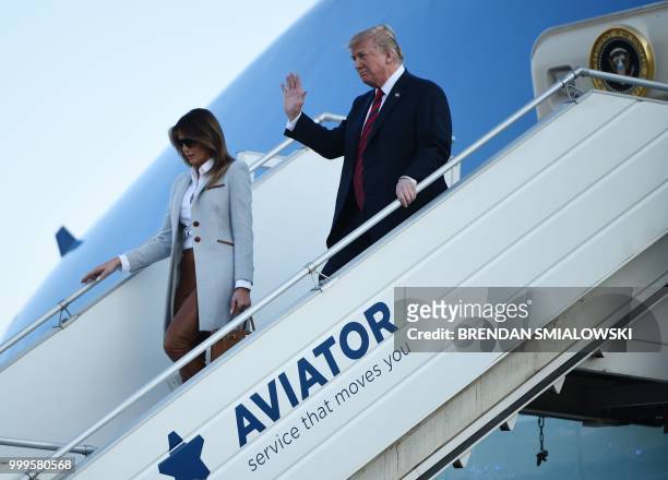 President Donald Trump and First Lady Melania Trump disembark from Air Force One upon arrival at Helsinki-Vantaa Airport in Helsinki, on July 15,...
