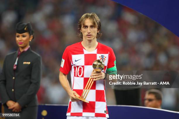 Luka Modric of Croatia poses with the FIFA Golden Ball for player of the tournament at the end of the 2018 FIFA World Cup Russia Final between France...