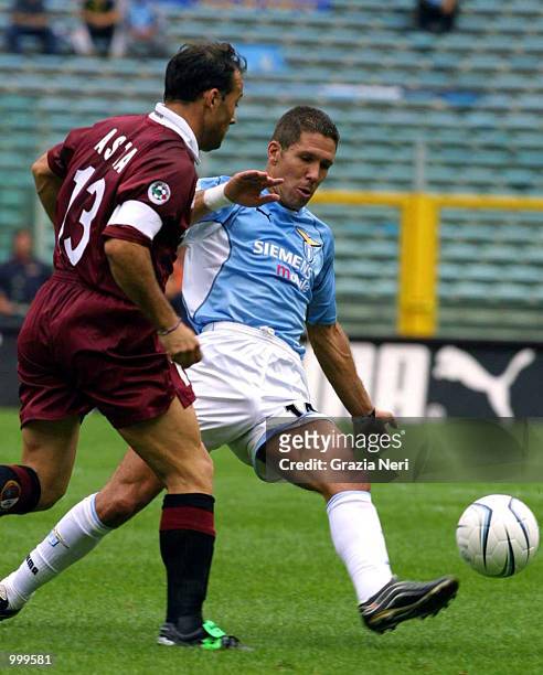 Simeone of Lazio and Asta of Torino in action during the Serie A 3rd Round League match between Lazio and Torino played at the Olympic Stadium in...