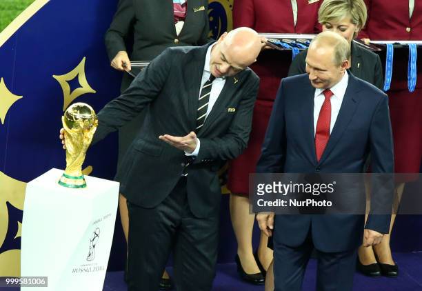 France v Croatia - FIFA World Cup Russia 2018 Final Fifa President Giovanni Infantino shows the trophy to Russia Federation President Vladimir Putin...