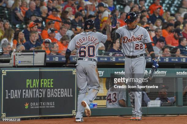Detroit Tigers infielder Ronny Rodriguez is congratulated by Detroit Tigers outfielder Victor Reyes after scoring on a sacrifice fly during the...