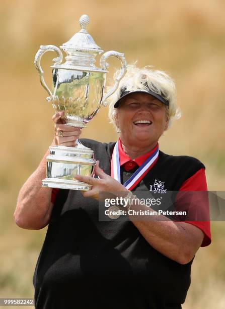 Laura Davies of England poses with the U.S. Senior Women's Open trophy after winning in the final round at Chicago Golf Club on July 15, 2018 in...