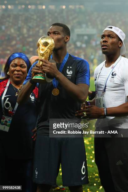 Paul Pogba of France celebrates victory with mother Yeo and brother Mathias at the end of of the 2018 FIFA World Cup Russia Final between France and...