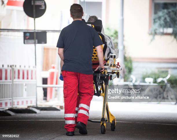 Patient of the Buergerhospital is pushed on stretcher in Frankfurt am Main , on 02 September 2017, to be transferred to a different hospital. The...