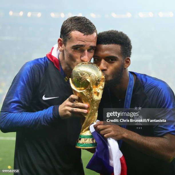 Antoine Griezmann of France celebrates with teammate Thomas Lemar after the 2018 FIFA World Cup Russia Final between France and Croatia at Luzhniki...