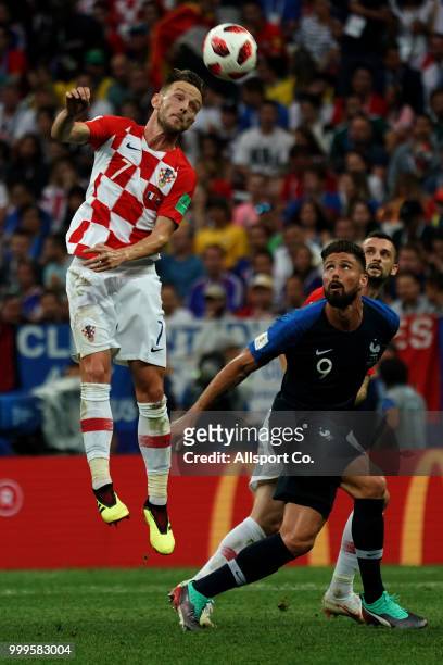 Olivier Giroud of France competes for the ball with Ivan Rakitic of Croatia during the 2018 FIFA World Cup Russia Final between France and Croatia at...