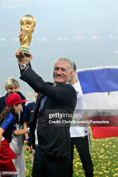 Head Coach of France Didier Deschamps celebrates with the World Cup trophy after the 2018 FIFA World Cup Russia Final between France and Croatia at...