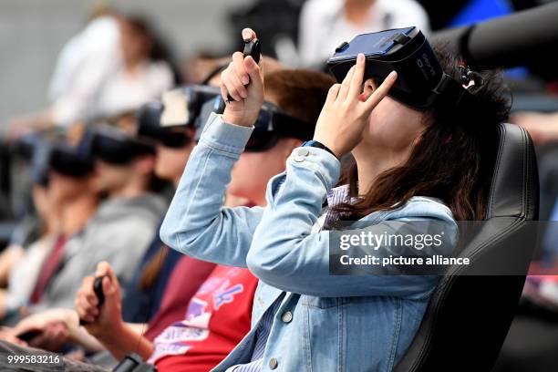 Visitors of the electronics fair IFA in Berlin are brought into a virtual world at the stand of Samsung with the help of special chairs and a 360...