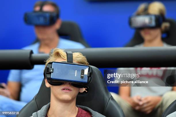Visitors of the electronics fair IFA in Berlin are brought into a virtual world at the stand of Samsung with the help of special chairs and a 360...