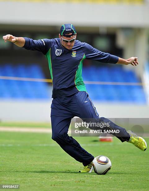 South African cricket team captain Graeme Smith kicks a soccer ball during a practice session at Sir Vivian Richards Stadium in St John's on May 18,...