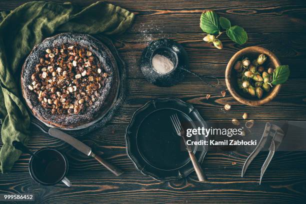 cake with hazelnuts and chocolate without flour on dark wooden t - adzuki bean stock pictures, royalty-free photos & images