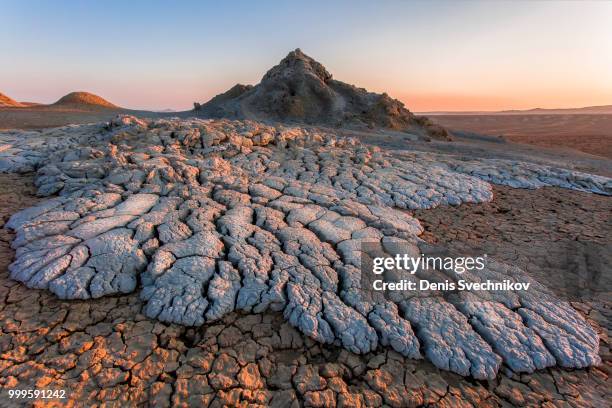 mud volcano at sunset - mud imagens e fotografias de stock