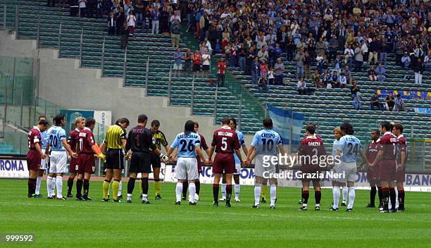 Players of both sides observe a minutes silence for the victims of the terrorist attack on New York before the start of the Serie A 3rd Round League...