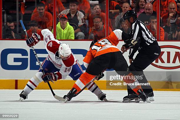 Tomas Plekanec of the Montreal Canadiens faces off against Mike Richards of the Philadelphia Flyers in Game 1 of the Eastern Conference Finals during...