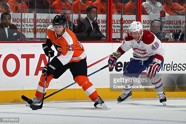 Andrei Kostitsyn of the Montreal Canadiens defends against Matt Carle of the Philadelphia Flyers in Game 1 of the Eastern Conference Finals during...