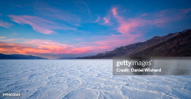 badwater basin in death valley national park at sunset - basin bildbanksfoton och bilder