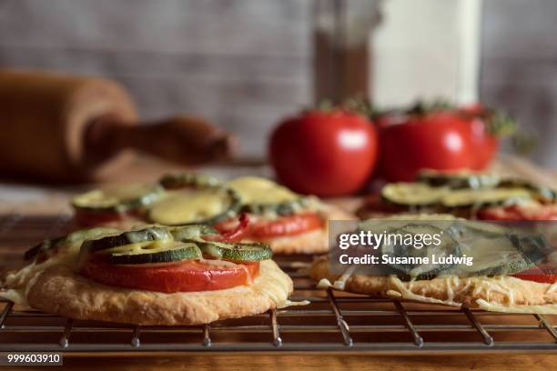 tiny pizza (2) - susanne ludwig stock pictures, royalty-free photos & images