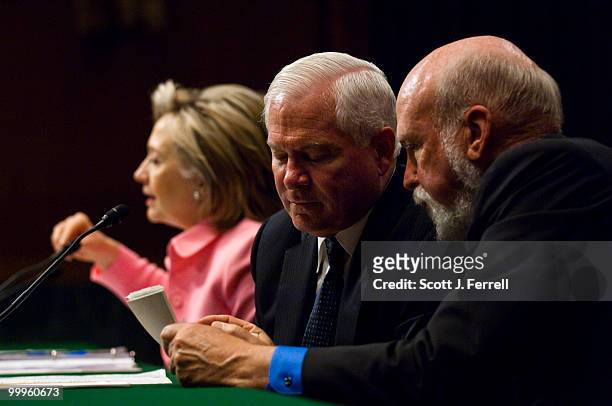 May 18: Secretary of State Hillary Rodham Clinton and Defense Secretary Robert M. Gates, speaking to an aide, during the Senate Foreign Relations...